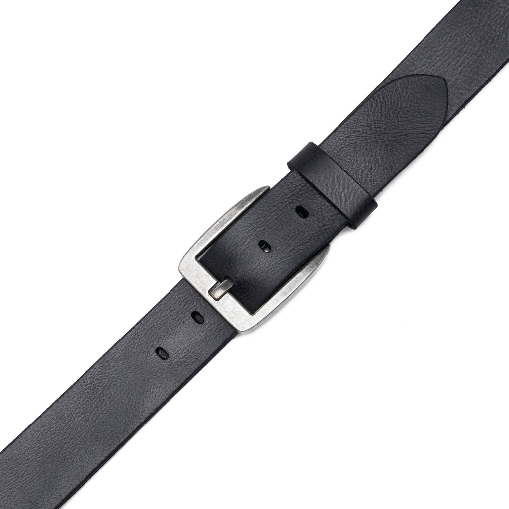 Close view of black leather belt buckle, fixed keeper, pointed tip, and adjustment holes