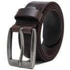 Brown full grain leather belt coiled with a square antique-silver single-prong buckle