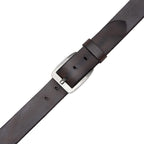 Close view of brown leather belt buckle, fixed keeper, pointed tip, and adjustment holes