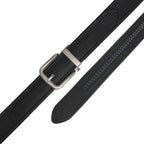 Black leather ratchet belt laid flat with its detachable buckle and visible adjustment track